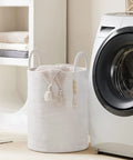 Cotton Rope Laundry Hamper Basket 58L Tall Woven Collapsible Organizer For Blankets Clothes Toys In Laundry Room Storage Go To For Busy Households Great For Dorms And Shared Living Spaces next to washing machine in laundry room.