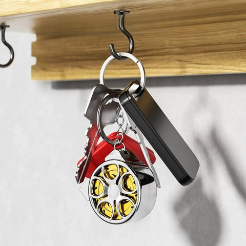 Hella Handy Keychain Tape Measure Boasting A Durable Steel Ruler Track And Totally Sick Wheel Hub Design For Pocket Ready Convenience When You Gotta Take Quick Measurements Right Now hanging with keys on hook