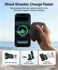 Hand holding Magnetic Wireless Camera Grip Power Bank 9300mAh with phone displaying charging status on beach.