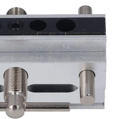 Close-up of Heavy Duty Auto Centering Dowel Jig Kit For Zero Hassle Furniture Assembly Adjustable Metric Drilling Guide with drill bit holes.