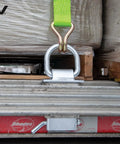 Silver Stake Pocket D Ring Assembly Set For Trailers, 4 Pack Covers Both Sides, installed on steel trailer frame with tie-down strap