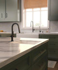 Modern hansgrohe Talis N Pull Down Kitchen Faucet, Magnetic Hand Sprayer, Matte Black, with elegant design in a kitchen setting.