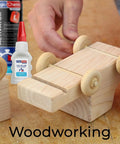 Hand gluing wooden toy car with Beast Mode Power Bond Cyanoacrylate Glue With Activator Kit, featuring glue and activator bottles.