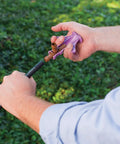 Drip Irrigation Barbed Fitting Insertion Tool For One Half Inch Tubing, Easy Full Insertion And Secure Locking in use outdoors
