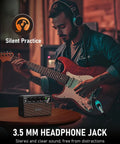 Musician using Compact 10W Guitar Amp With Clean And Drive Channel USB C Rechargeable Wireless Portable Practice Amp