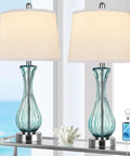 Coastal Glass Table Lamp Set Of 2, 27.5 Inch Blue Nautical Bedside Lamps with White Linen Shade, USB Ports, on a table by the ocean view.