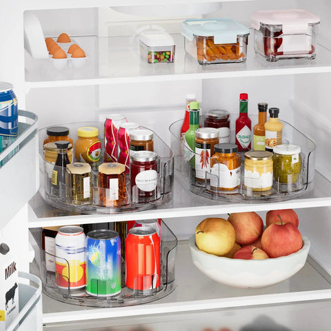 Smooth Spin Rectangular Lazy Susan Turntable Keeps Your Kitchen Super Slick And Totally Stress Free For Fridge Condiments Spices Pantry Jars And Countertop Organization Without Any Fuss. Clear plastic turntable in fridge with jars, sauces, and apples.