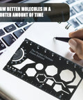 Organic Chemistry Stencil And Drawing Template Durable Metal Drafting Kit for chemists in use on desk next to keyboard