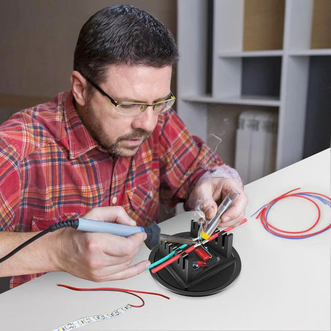Man using Game Changing Aluminum Alloy Magnetic Helping Hands Soldering Station With Base Third Hand Stand for wire soldering