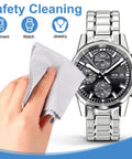 Hand using Gentle Microfiber Cleaning Cloths For Glasses And Electronics Pack Of 50 Pcs to clean a stainless steel watch