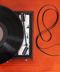 Turntable Belt Kit With Five Sizes For Belt Driven Record Players Replacement Belts For Repair And Maintenance Includes 300x5x1.0mm, 206x5x0.6mm, 172x5x0.6mm, 150x4x0.9mm, And 128x5x0.6mm next to a turntable