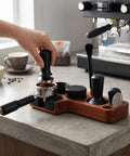 Premium Spring Loaded 51Mm Coffee Espresso Tamper Set Delivering Exact 30 Pound Pressure for puck prep on countertop with tools.