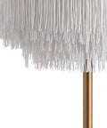 Close-up of white tassel shade on gold base, Gold Two Light Fringed Metal LED Table Lamp With White Tassel Shade