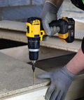 Worker using a drill with Torx drive bit to install Top Shelf One Inch Exterior Deck Screws Bronze Epoxy Coated for outdoor fencing.