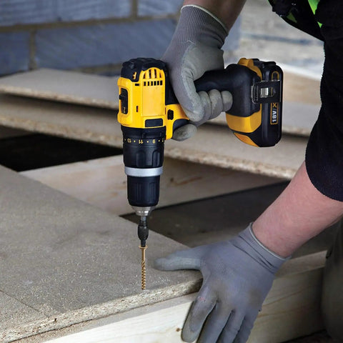 Worker using a drill with Torx drive bit to install Top Shelf One Inch Exterior Deck Screws Bronze Epoxy Coated for outdoor fencing.
