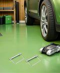 Garage setting with car and Six Pack 4 Inch Heavy Duty Stainless Steel Wire Lock Hitch Pin Quick Release Safety Lock on the floor.