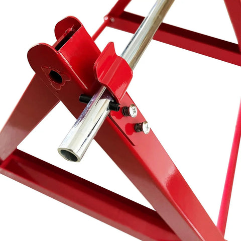 Close-up of Foldable Cable Reel Drum Roller Holder And Spool Dispenser With Wire Rack in red stainless steel frame