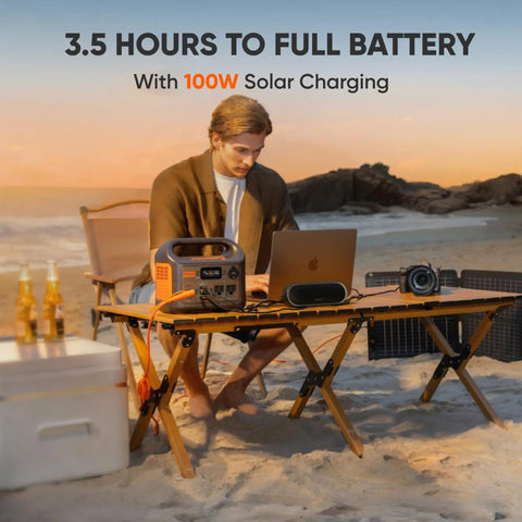 Person using Beast Portable Solar Generator Explorer 300 Power Station 292Wh With 40W Solar Panel on beach at sunset