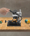 Hand using Mini Drill Press For Jewelry Making And PCB Projects Dope Precision Benchtop Drilling Machine with 0-8000 RPM on wood