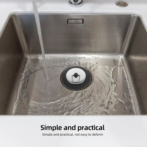 Rubber Bathtub Drain Plug with Stainless Steel Easy Pull-Out Stopper in a stainless sink with flowing water.