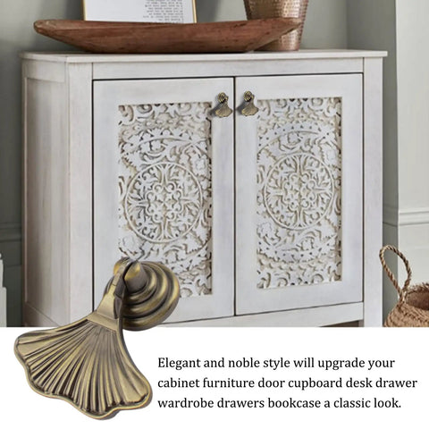 Ginkgo Leaf Knob Handles Six Pack Antique Brushed Bronze Pendant Pulls on a white decorative cabinet