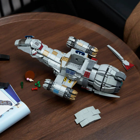 Epic Sci-Fi Spaceship Building Set For Adults, 1345-Piece Space War Ship Model on table with additional pieces