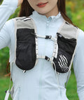 Woman wearing 5L Reflective Hydration Running Vest For Ride Ready Comfort with lightweight quick-dry breathable fabric