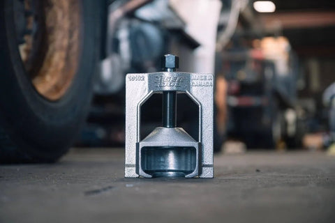 Close-up of Heavy Duty U Joint Puller For Class 7 And 8 Trucks And Equipment in a garage setting, front view