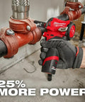 Hand using M12 RedLithium High Output 2.5Ah Battery With RedLink Intelligence Delivers Beefy XC Power In A Compact Size tool on pipe