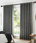 Bronze Adjustable Curtain Rod Set For Windows 32 To 144 Inches, installed in living room with round finials and grey drapes.
