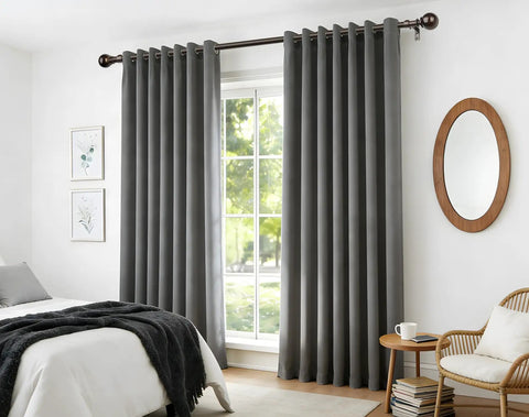 Bronze Adjustable Curtain Rod Set For Windows 32 To 144 Inches, installed in living room with round finials and grey drapes.