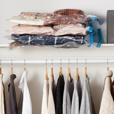 Vacuum Storage Bags Large 5 Pack With Hand Pump For Clothes And Linens stacked on closet shelf
