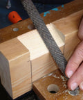 Eight Inch Carbon Steel Wood Rasp File Set Three Piece Kit in use on a softwood plank for shaping and smoothing.