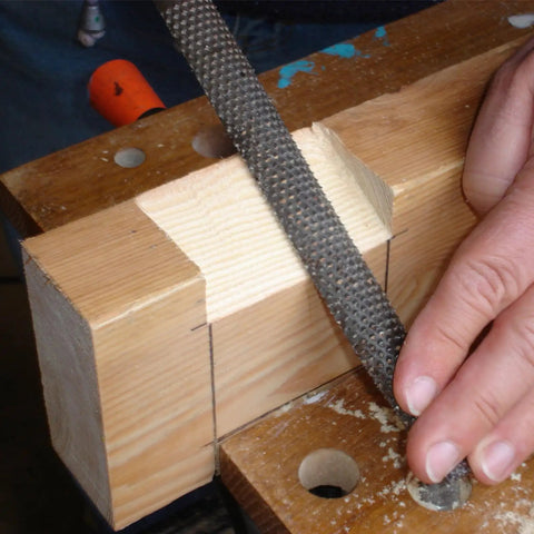 Eight Inch Carbon Steel Wood Rasp File Set Three Piece Kit in use on a softwood plank for shaping and smoothing.