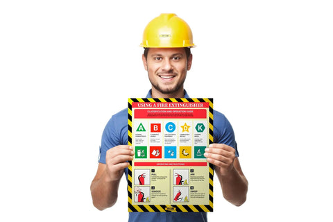 How To Use A Fire Extinguisher Poster For The Workplace Non Laminated 12 By 16 Inch Safety Chart With Clear Step By Step Instructions And High Visibility Yellow Design For Fast Real World Training held by a person in work attire.