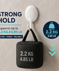 Heavy Duty Adhesive Wall Hooks For Bathroom And Kitchen No Drill Strong Sticky Hangers For Towels Coats Zero Hassle Residue Free 4 Pack displaying a hook supporting 2.2 KG