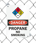 Heavy Duty Aluminum Danger Propane No Smoking Warning Sign NFPA 7 X 10 Inch Plate mounted on chain link fence.