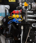 Front view of 1/2-inch flat-face hydraulic dust caps and plugs set; red, yellow, blue caps on connectors