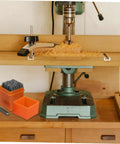 37 Piece Metal Stamping Kit With Letter And Number Punch Set Plus Heart Symbols next to a woodworking drill press