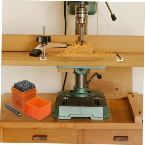 37 Piece Metal Stamping Kit With Letter And Number Punch Set Plus Heart Symbols next to a woodworking drill press