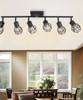 Black 6 Light Farmhouse Track Lighting Fixture with Metal Cage Design installed in a living room ceiling