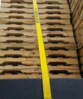 Beefy Heavy Duty 2 Inch Ratchet Tie Down Straps 27 Ft With Double J Hook And Edge Guard securing wooden pallets on truck