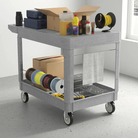 Heavy Duty Plastic Utility Cart On Wheels With Large Flat Top 46 By 25 Inch Work Cart Two Shelf Rolling Service Cart 1000 Lb Capacity Built Tough For Warehouse Garage Cleaning Gray, loaded with boxes and tools.