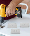 Heavy Duty Furniture Leg Mounting Plates 10 Pack Featuring 12mm Thickness For Sofa Assembly, worker installing plates with drill.