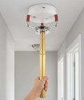 Top Grade Smoke Transducer Assembly Tool For High Ceilings With Rugged Aluminum Alloy Grip in use to remove ceiling smoke detector.
