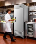 Tough As Nails 27 Wide Commercial Freezer 23 Cubic Ft Stainless Steel Reach In Upright Freezer in a busy restaurant kitchen.