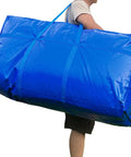 Man carrying Massive 66 Gallon Extra Large Storage Bag With Zipper And Tough Handles, Heavy Duty Foldable Duffle Bag For Travel Or Moving