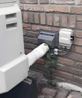 HVAC Wall Penetration Cover Kit With Dense Rubber Seal Blocks Drafts Hides Ugly Ac Lineset on brick wall with tubing.