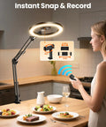 Woman using Ultra Flexible Overhead Ring Light With Desk Mount And Hands Free Phone Holder 10 Inch Selfie Light on kitchen counter