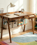 Score This Legit 47 Inch Solid Wood Writing Desk With Warm Walnut Finish Spacious Desktop Heavy Duty Build Delivering That Premium Mid Century Look For Your Office Setup with books and lamp.